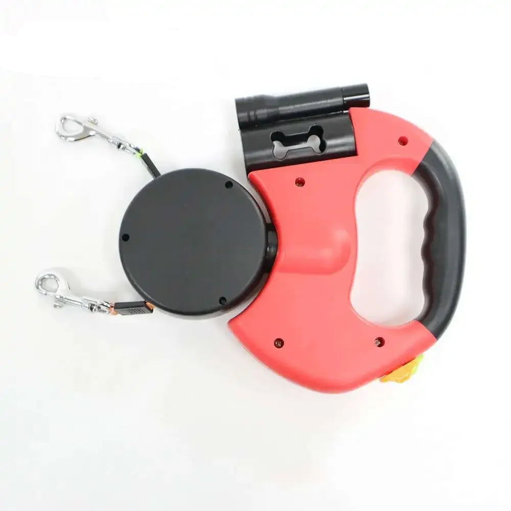Red retractable dog leash with black handle on a white background